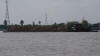 Fully Loaded Barge Travelling Down The Mekong River, Vietnam